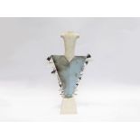 JOANNA REYNOLDS (XX): A ceramic figure in whiteand smoke fired blue, applied with feathers.