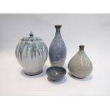 A collection of four studio pottery items by the same hand with ash and blue glazes. Tallest 25.
