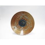 A salt glazed studio pottery plate probably by a student of Walter Keeler,