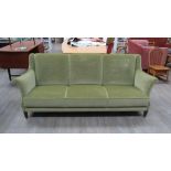 A Danish 1940's three seater sofa with green velour upholstery,