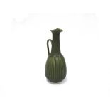 Gunnar Nylund for Rosenthal - A ceramic ewer with speckled green glaze, incised vertical line body.