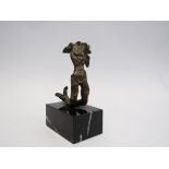 A bronze sculpture on marble base,