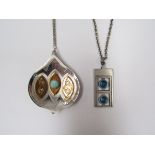 Two Danish stainless steel pendants with inset glass