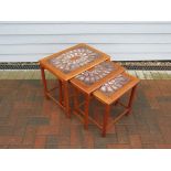 A nest of three tile topped tables made in Denmark by Mobelfabrick Toften 1960's (stamped to