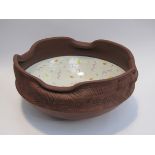 In the style of Jonathan Keep - a large studio bowl, white glazed interior with geometric motifs,