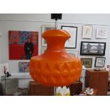 A Peill & Putzler orange glass ceiling pendant light