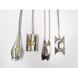 Four vintage 1970's stainless steel pendants with abstract modernist designs including Adeline by