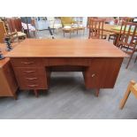 A Danish teak twin pedestal desk,