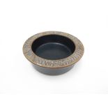 Lisa Larson for Gustavsberg - A stoneware bowl in blue with impressed motifs to flattened rim.