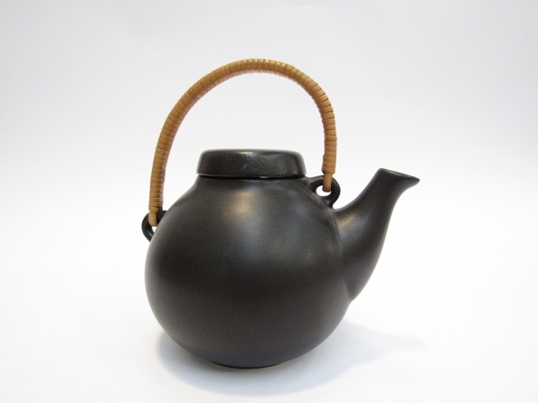 An Arabia teapot, cane handle, designed by Ulla Procope,