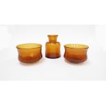 Erik Hoglund - A pair of Boda amber glass bowls with internal bubbles, etched No.