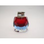 A Murano Sommerso lighter in red, encased in blue glass with faceted detail,