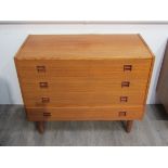 A Danish teak chest of four drawers, raised on tapering legs, 88cm x 42.