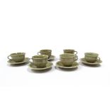 DAVID LEACH (1911-2005) A set of six porcelain tea cups with pale olive green glazed, fluted body,