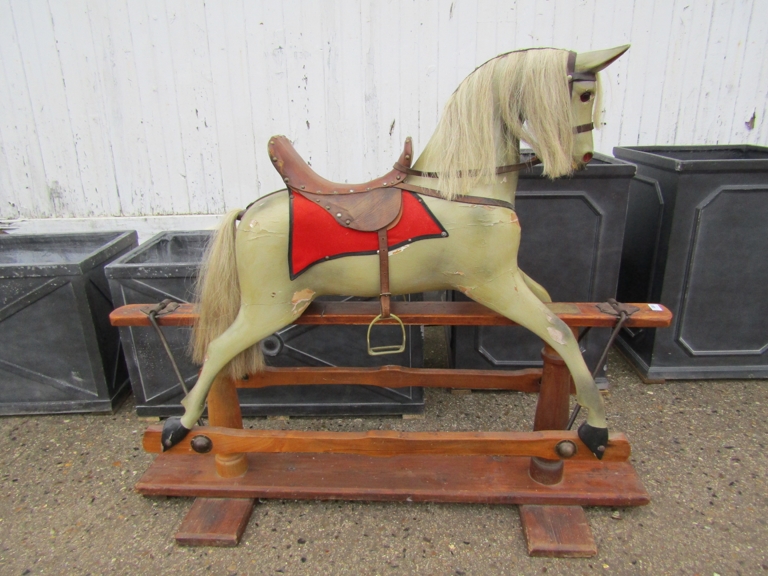 A late Victorian/Edwardian painted wooden bodied rocking horse with horse hair mane and tail with
