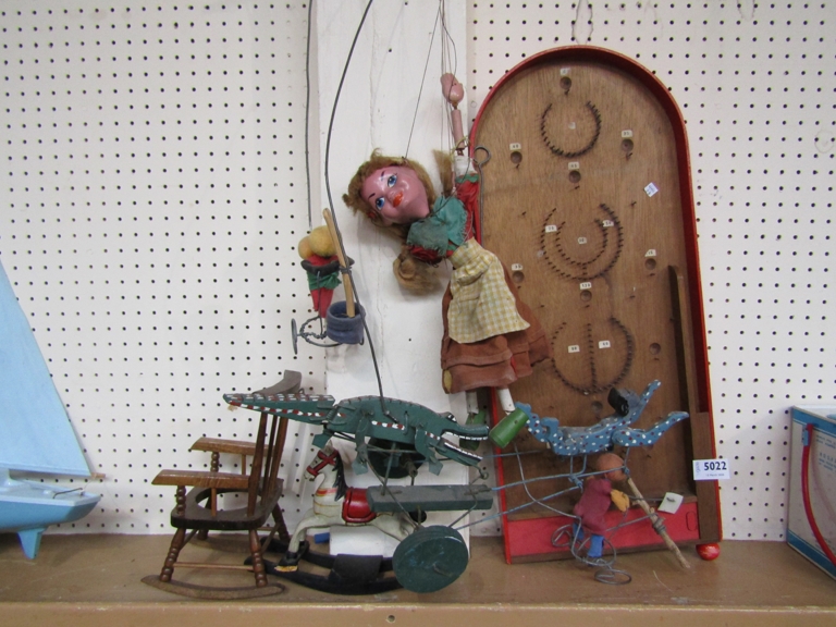 Assorted wooden toys including Pelham puppet, bagatelle,