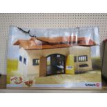 A boxed Schleich horse stable,