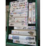 Sixteen Tamiya military model kits with sealed contents and instructions