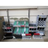 Five Scalextric trackside buildings and accessories