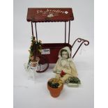 A metal model French flower cart and miniature doll