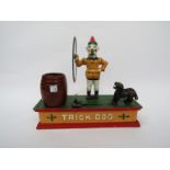 A reproduction cast iron 'Trick Dog' mechanical money box