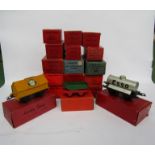 Eighteen Hornby 0 gauge wagons, coaches and buffer stops,