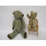 A care worn blue plush soft filled jointed bear with leather pads and a small straw filled jointed