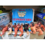 A collection of wrestling figures,