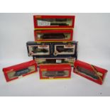Eight items of boxed 00 guage rolling stock including Bachmann and Hornby