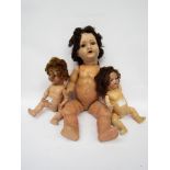 Two Armand Marseille bisque head dolls on jointed composition bodies and a jointed composition girl