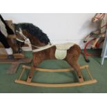 A rocking horse on bowed rocker