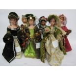 A set of six costume dolls