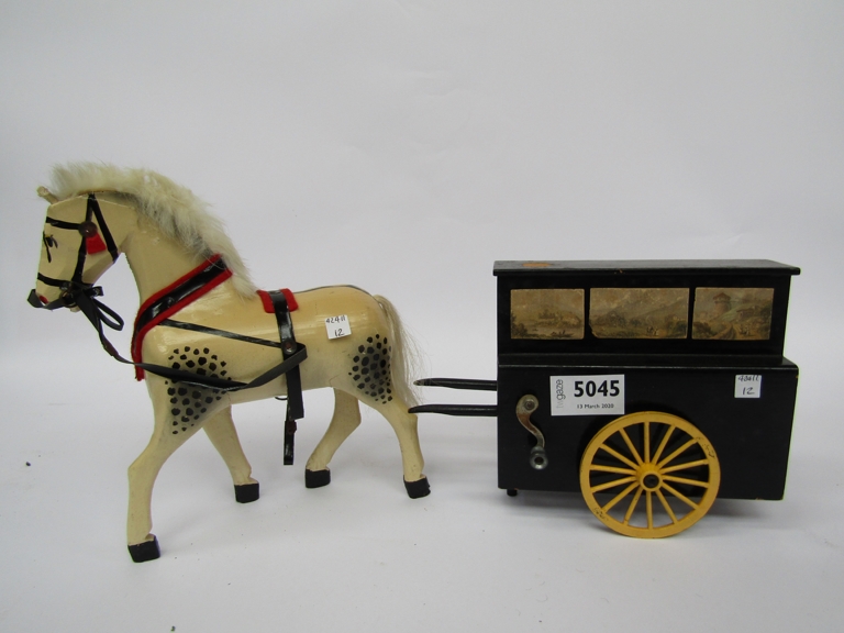 A model mechanical organ and a painted model horse