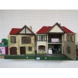 A Tri-Ang two storey dolls house containing furniture and figures and another similar