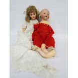 An Armand Marseille 351 bisque head baby doll on jointed compostion body and a French bisque doll