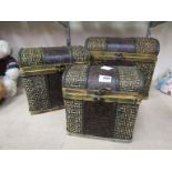 A graduated set of three woven toy storage trunks