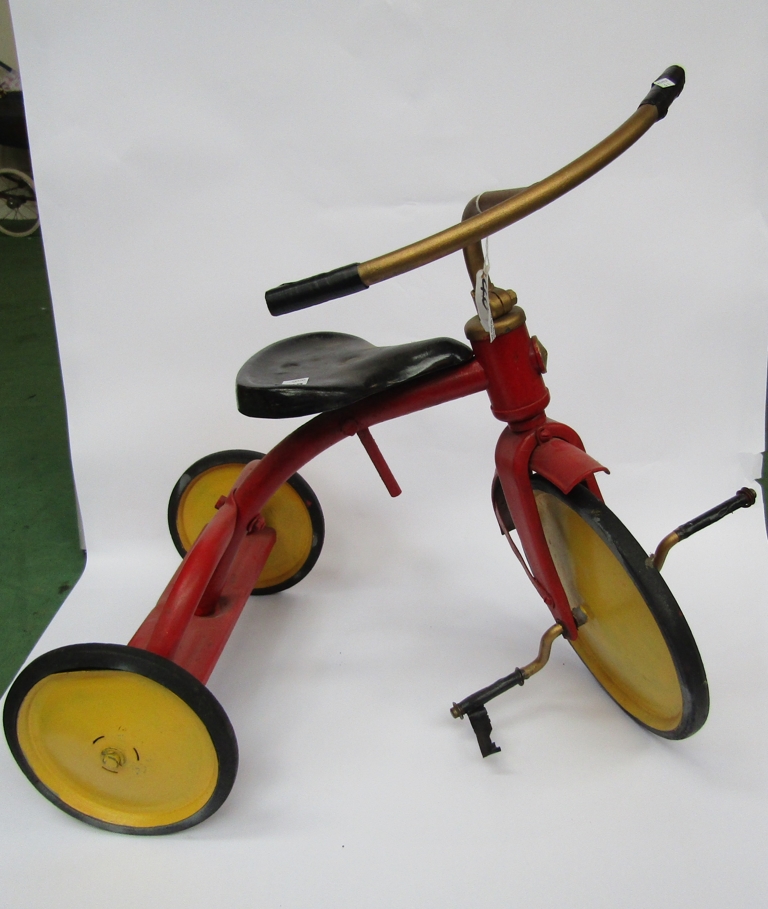 A childs metal tricycle