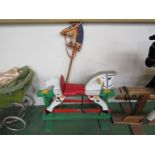 A painted wooden rocking horse and hobby horse