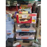 Eleven assorted boxed diecast cars including Dinky and Matchbox