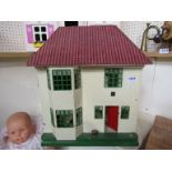 A vintage two storey dolls house