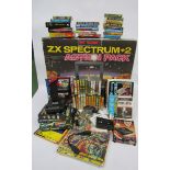 A boxed Sinclair ZX Spectrum +2 Action Pack with accessories and games