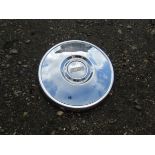 A chromed Fiat hub cap