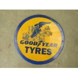 An enamelled sign 'Goodyear tyres'.