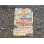 An enamel sign 'Austin - Sales and Service,