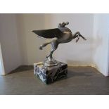 A chromed Pegasus mascot mounted on a marble base