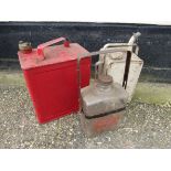 Two fuel cans and a glass stove fuel bottle