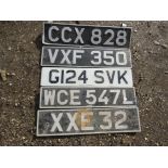 Five vintage number plates