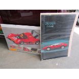 A pack of Ferrari 328 posters and a pack of IMSA Ferrari posters.