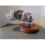 A chromed circa 1930's Telcote pup 'Bonzo' mounted on plinth