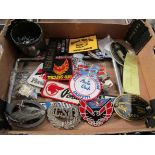 A box containing number plate surrounds, badges including Ford,